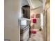 Hallway leading to a bathroom with decorative accents and cherry cabinets at 2804 Dominion Nw Ln # Bldg 2, Kennesaw, GA 30144