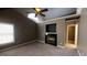 Cozy bedroom with fireplace, neutral carpeting, and a large window for natural light at 2804 Dominion Nw Ln # Bldg 2, Kennesaw, GA 30144