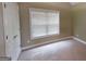 Bright bedroom with neutral carpeting, a window, and a closet with double doors at 2804 Dominion Nw Ln # Bldg 2, Kennesaw, GA 30144