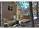Tan siding, brick patio and lush, leafy trees surround the house at 2804 Dominion Nw Ln # Bldg 2, Kennesaw, GA 30144