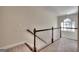 Hallway landing with carpet and decorative lighting from a window at 2804 Dominion Nw Ln # Bldg 2, Kennesaw, GA 30144