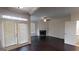 Elegant living room featuring a fireplace, hardwood floors, and access to outdoor patio at 2804 Dominion Nw Ln # Bldg 2, Kennesaw, GA 30144