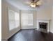 Bright living room with hardwood floors, fireplace, and ample natural light from large windows at 2804 Dominion Nw Ln # Bldg 2, Kennesaw, GA 30144
