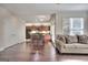 Open concept living space showcases hardwood floors and a comfortable couch at 2804 Dominion Nw Ln # Bldg 2, Kennesaw, GA 30144