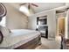 Main bedroom with fireplace, TV and decorative arch window at 2804 Dominion Nw Ln # Bldg 2, Kennesaw, GA 30144