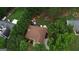 Aerial view of the property featuring a well-maintained lawn, swimming pool, patio, and mature trees at 55 Ashton Pl, Covington, GA 30016