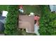 Overhead aerial view of a house with a well-manicured lawn, mature trees, and a roof in good condition at 55 Ashton Pl, Covington, GA 30016