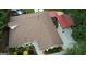 Expansive aerial view of a home with a well-maintained roof, lush landscaping, and a backyard pool and entertainment area at 55 Ashton Pl, Covington, GA 30016