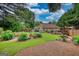 Expansive backyard featuring a cozy fire pit area, perfect for outdoor gatherings and relaxation at 55 Ashton Pl, Covington, GA 30016