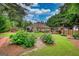Expansive backyard featuring a cozy fire pit area, perfect for outdoor gatherings and relaxation at 55 Ashton Pl, Covington, GA 30016