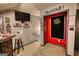 Basement entertainment space with bar, dart board, and TV for fun and relaxation; great for hosting game nights at 55 Ashton Pl, Covington, GA 30016