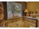 Bright bathroom showing a soaking tub, decorations, natural light, and modern fixtures at 55 Ashton Pl, Covington, GA 30016