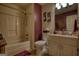 Comfortable bathroom featuring a shower-tub combination and a granite countertop vanity at 55 Ashton Pl, Covington, GA 30016
