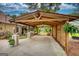 Inviting car port featuring wood beams and view of outdoor seating at 55 Ashton Pl, Covington, GA 30016
