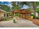 Large wooden car port with view of house and outdoor seating at 55 Ashton Pl, Covington, GA 30016