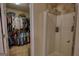 Bathroom including a glass door shower and next to an ample walk in closet at 55 Ashton Pl, Covington, GA 30016