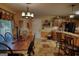 Warm dining space with a decorative chandelier, leading to the kitchen at 55 Ashton Pl, Covington, GA 30016