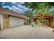 Large home featuring long driveway leading to garage and car port at 55 Ashton Pl, Covington, GA 30016