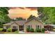 Charming single-Gathering home featuring traditional architecture and mature landscaping at 55 Ashton Pl, Covington, GA 30016