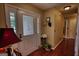 Inviting foyer featuring a decorative glass door, wood floors, and tasteful decor, creating a warm and welcoming entrance at 55 Ashton Pl, Covington, GA 30016