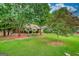 Well maintained house showcasing manicured lawn, trees and landscaping at 55 Ashton Pl, Covington, GA 30016