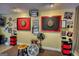 Finished basement game room showcasing two dart boards, team decorations, and a unique design at 55 Ashton Pl, Covington, GA 30016