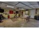 Finished garage with a kitchenette, dart boards, and sports themed decor creating an entertaining and functional space at 55 Ashton Pl, Covington, GA 30016