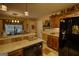 This kitchen has wood cabinets, stainless steel appliances, and an eat-in dining area at 55 Ashton Pl, Covington, GA 30016