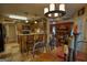 Charming kitchen with breakfast bar and wood cabinets, open to the dining and living areas at 55 Ashton Pl, Covington, GA 30016