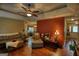 Well-lit living room featuring hardwood floors and seamless connection to other living spaces at 55 Ashton Pl, Covington, GA 30016