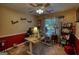 Bright office space with a ceiling fan, uplifting wall decor, and large window that allows plenty of natural light at 55 Ashton Pl, Covington, GA 30016