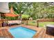Inviting backyard pool with surrounding deck space and comfortable seating perfect for relaxation and outdoor gatherings at 55 Ashton Pl, Covington, GA 30016