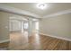 Spacious basement with hardwood floors, white columns, and neutral walls at 3451 Fairway Dr, College Park, GA 30337