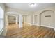 Spacious basement area with wood floors, columns, and doorways at 3451 Fairway Dr, College Park, GA 30337