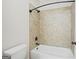 Neutral bathroom design with tiled shower and classic fixtures at 3451 Fairway Dr, College Park, GA 30337