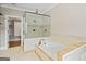Bright bathroom features a shower, separate soaking tub, and walk-in closet at 3451 Fairway Dr, College Park, GA 30337