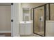 Bathroom featuring a glass shower with dark trim and a white vanity with modern fixtures at 3451 Fairway Dr, College Park, GA 30337