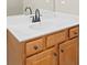 Bathroom featuring a wood vanity cabinet and solid surface countertop at 3451 Fairway Dr, College Park, GA 30337