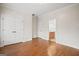 Bright bedroom with hardwood floors, closet, and ensuite bathroom at 3451 Fairway Dr, College Park, GA 30337