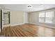 Bright, spacious bedroom with wood floors, large windows, and white trim throughout at 3451 Fairway Dr, College Park, GA 30337