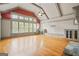 Large bonus room featuring vaulted ceiling, expansive windows, and built-in storage cabinets at 3451 Fairway Dr, College Park, GA 30337