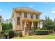 Charming two-story home featuring a welcoming front porch with stone accents and well-manicured landscaping at 3451 Fairway Dr, College Park, GA 30337