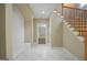 View of a nice foyer with tile flooring, bench, and staircase at 3451 Fairway Dr, College Park, GA 30337