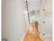 Bright hallway with hardwood floors leading to stairway and rooms at 3451 Fairway Dr, College Park, GA 30337