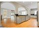 Open-concept kitchen with a large island, granite countertops, and seamless access to living spaces at 3451 Fairway Dr, College Park, GA 30337