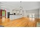 Spacious living room with hardwood floors and modern lighting fixtures at 3451 Fairway Dr, College Park, GA 30337
