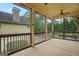 View of a covered patio with wood floors and screened windows at 3451 Fairway Dr, College Park, GA 30337