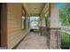 Inviting covered porch with stone pillars and a flagstone floor, perfect for relaxing and enjoying the outdoors at 3451 Fairway Dr, College Park, GA 30337
