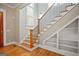 Staircase with hardwood steps and built-in shelving on lower level at 3451 Fairway Dr, College Park, GA 30337