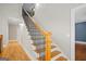 View of the staircase featuring hardwood steps and black metal railing at 3451 Fairway Dr, College Park, GA 30337